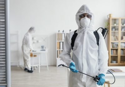 people disinfecting together dangerous area